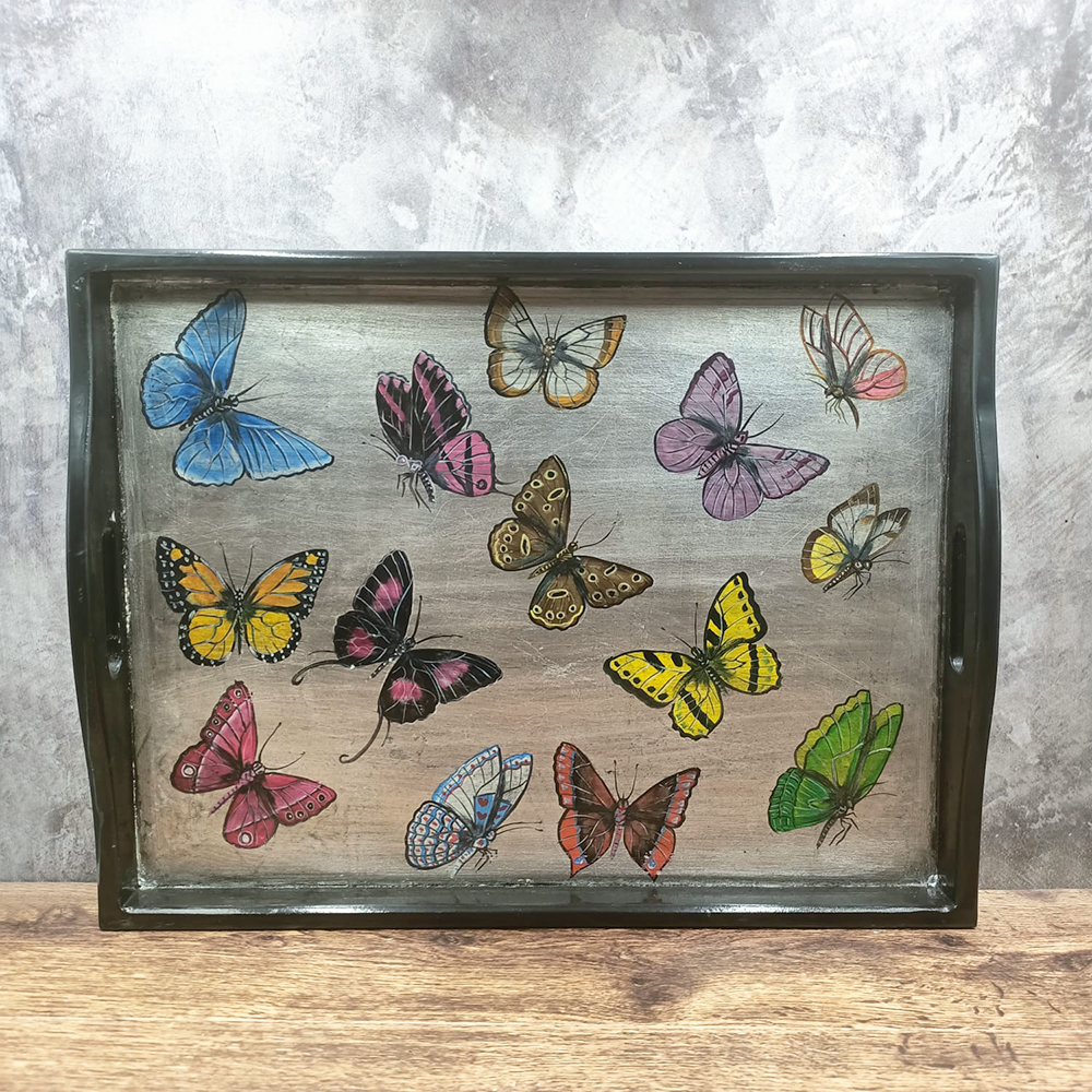 Black and silver tray with colorful butterflies