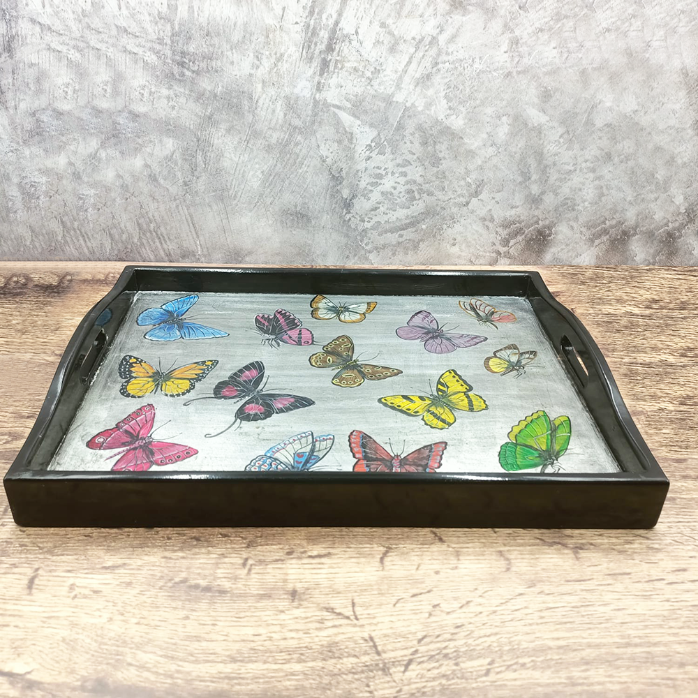 Black and silver tray with colorful butterflies