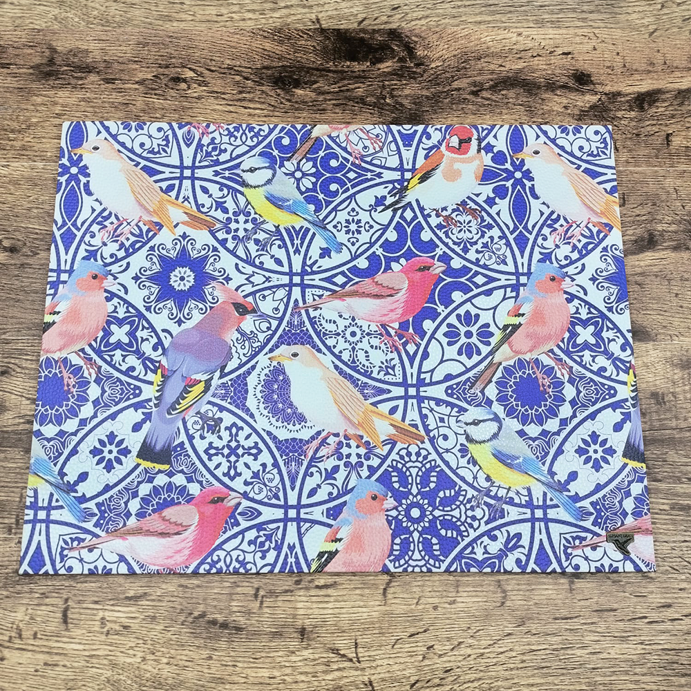 Blue and beige rigid placemat with little birds