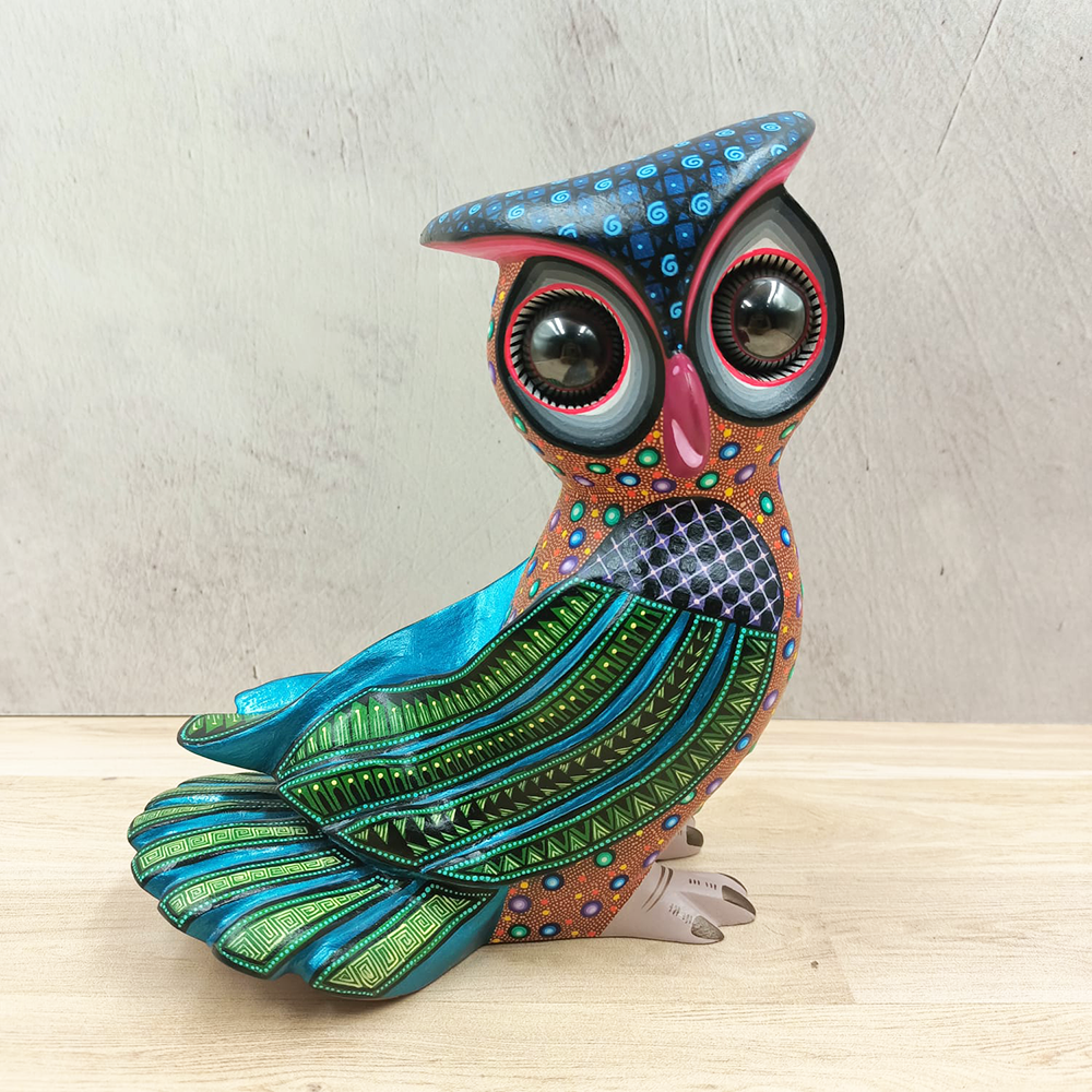 Brown alebrije owl with green wings