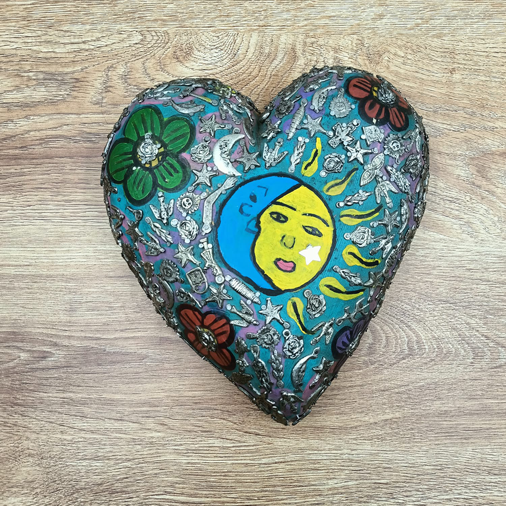 Large painted aqua heart with little miracles