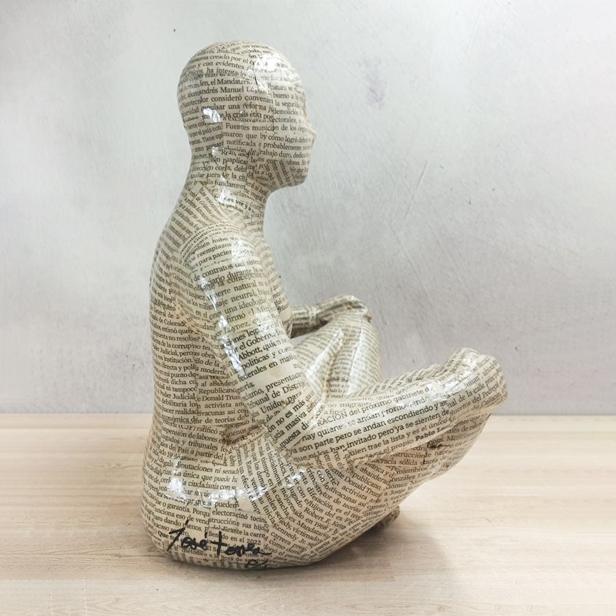 Adam covered with newspaper style sheets