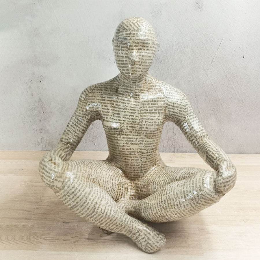 Adam covered with newspaper style sheets