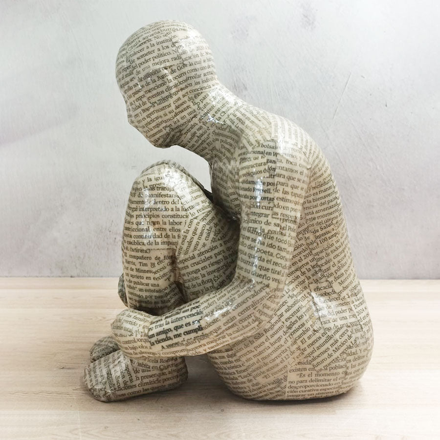 Adam without a book with a newspaper-style cover