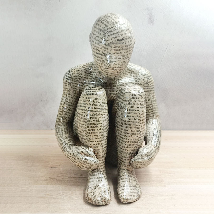 Adam without a book with a newspaper-style cover