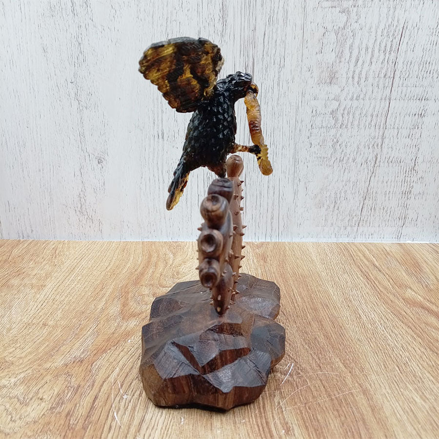 Amber eagle on a prickly pear cactus