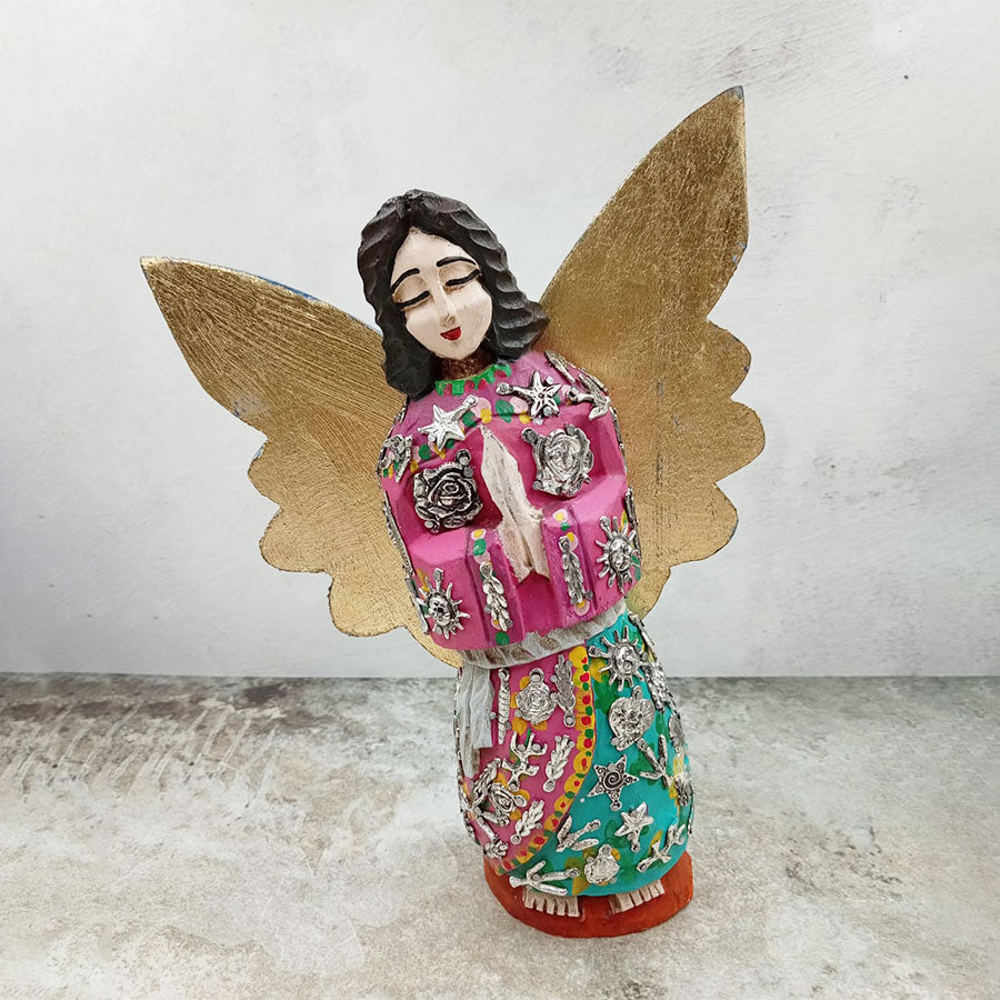 Pink angel with outstretched wings and "milagritos"