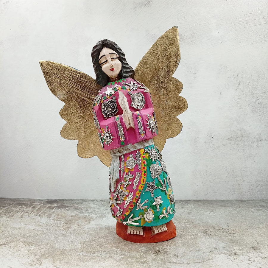 Pink angel with outstretched wings and "milagritos"