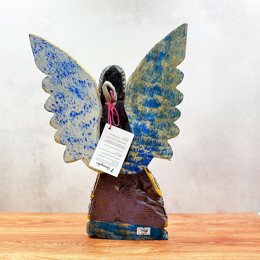 Angel with outstretched wings and "milagritos"