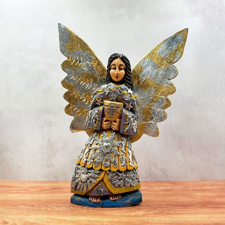 Angel with outstretched wings and "milagritos"