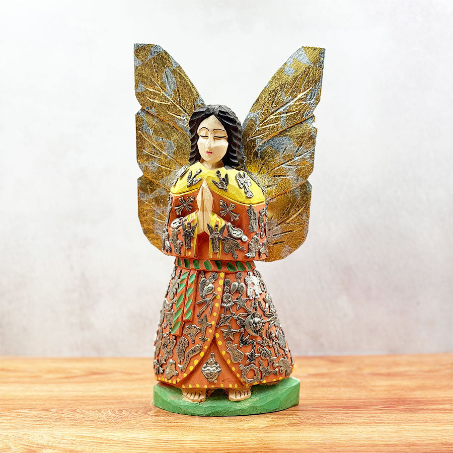 Angel with outstretched wings and "milagritos"