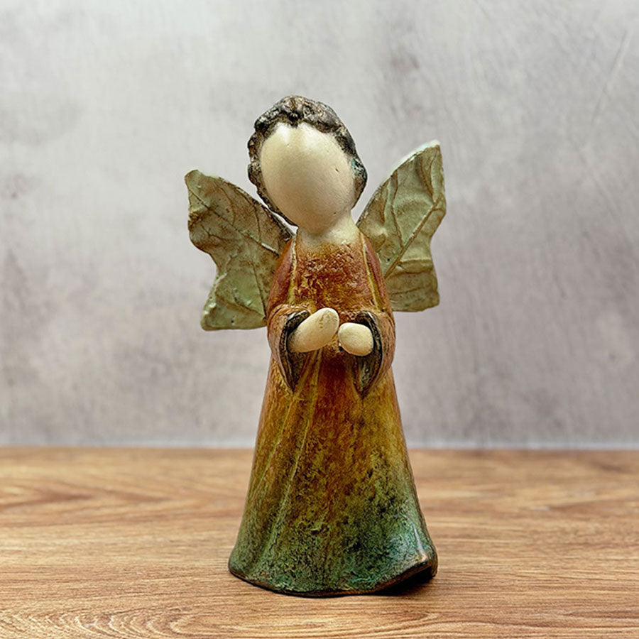 Little angel with green wings