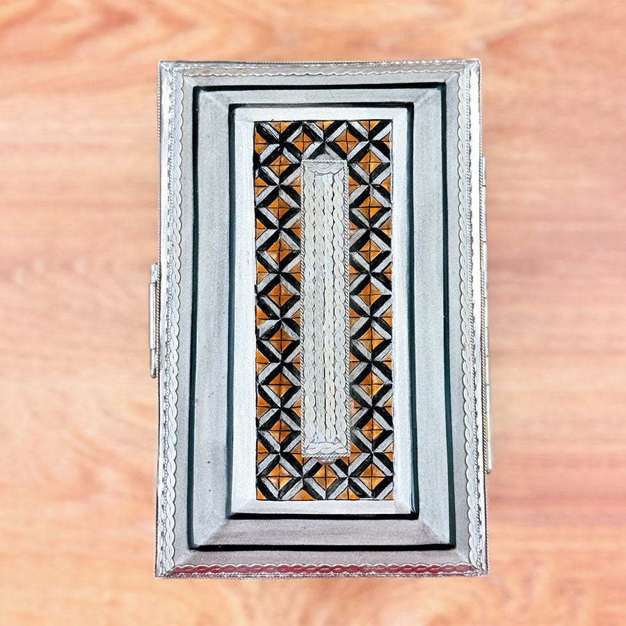Brown chest with checkered design