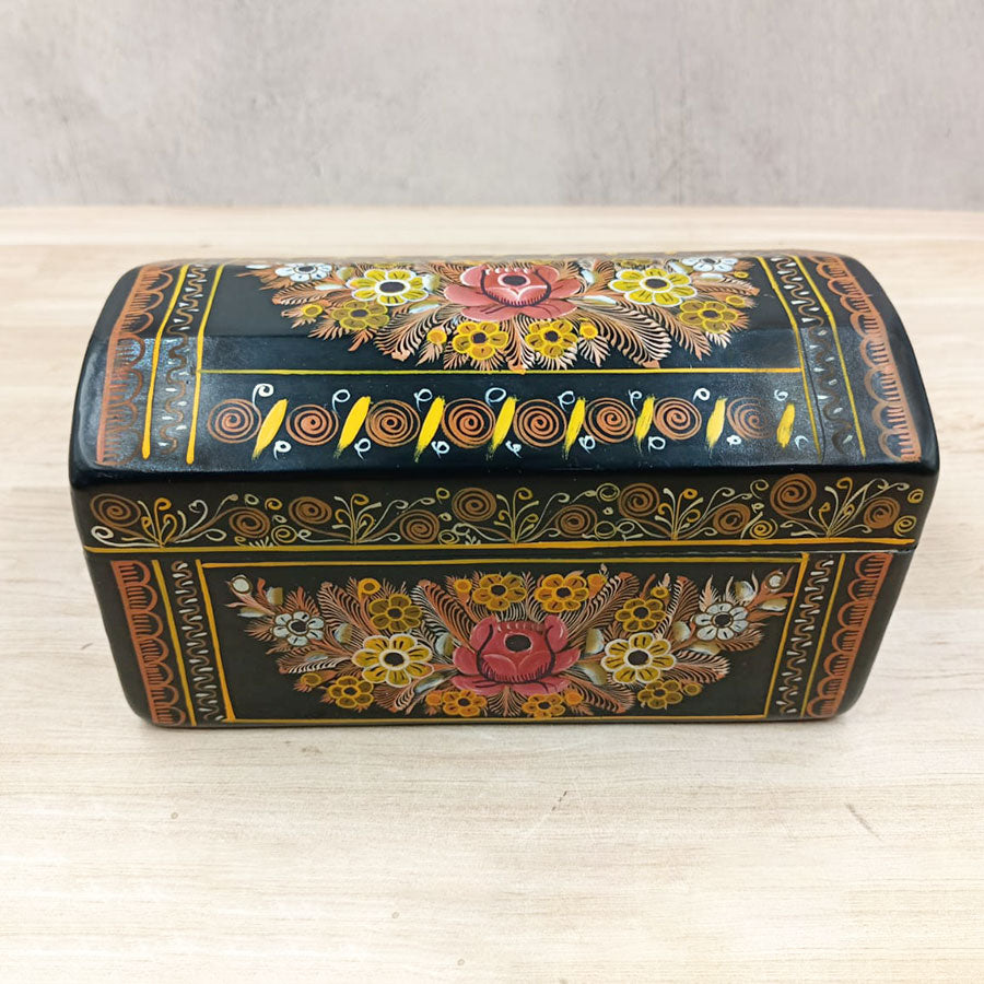 Black trunk with flowers