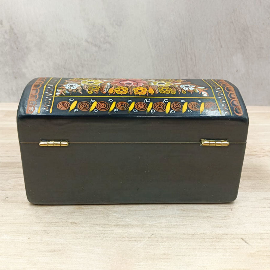 Black trunk with flowers