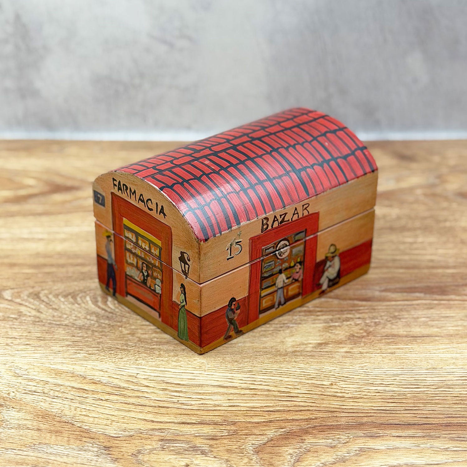 Small chest decorated with a little house design