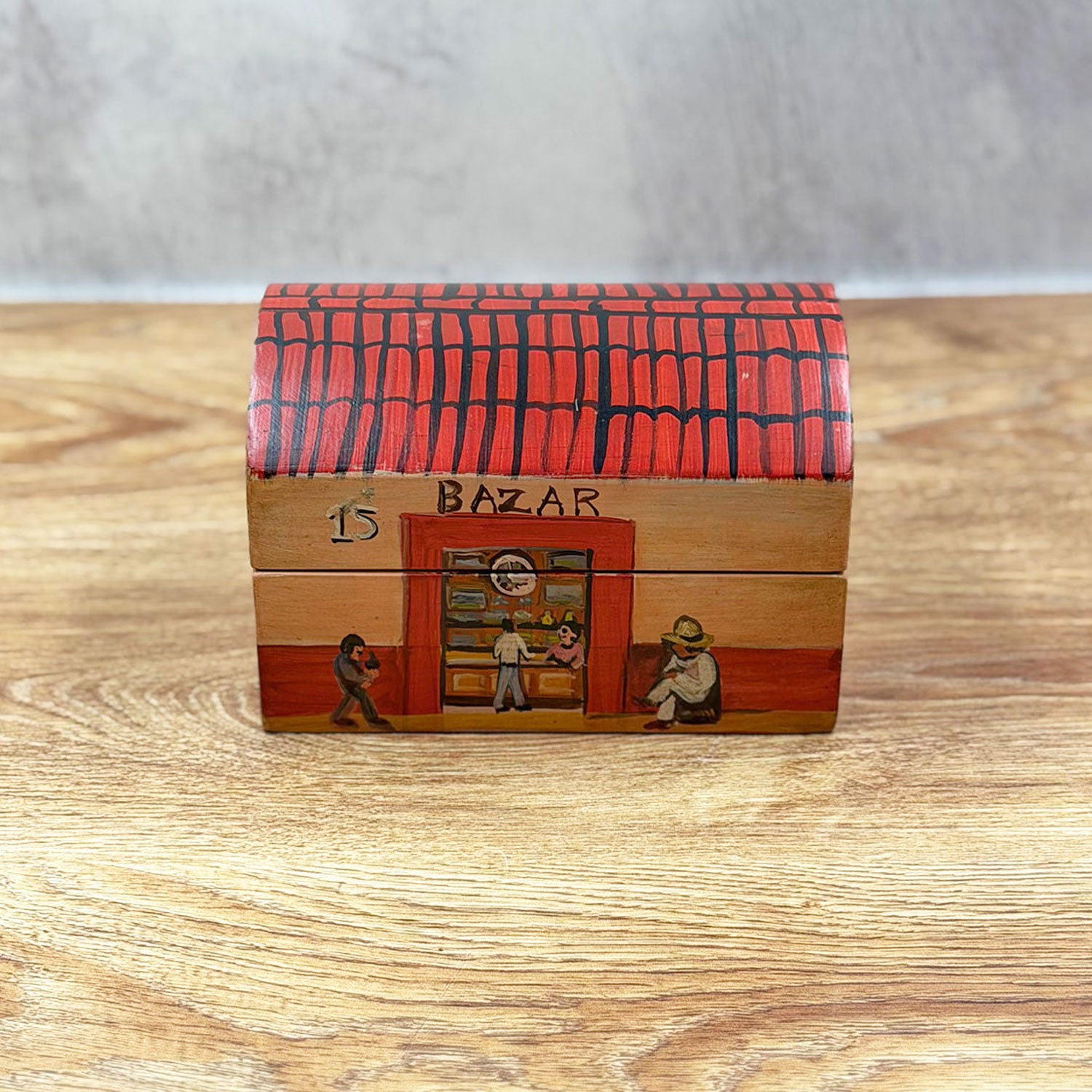 Small chest decorated with a little house design
