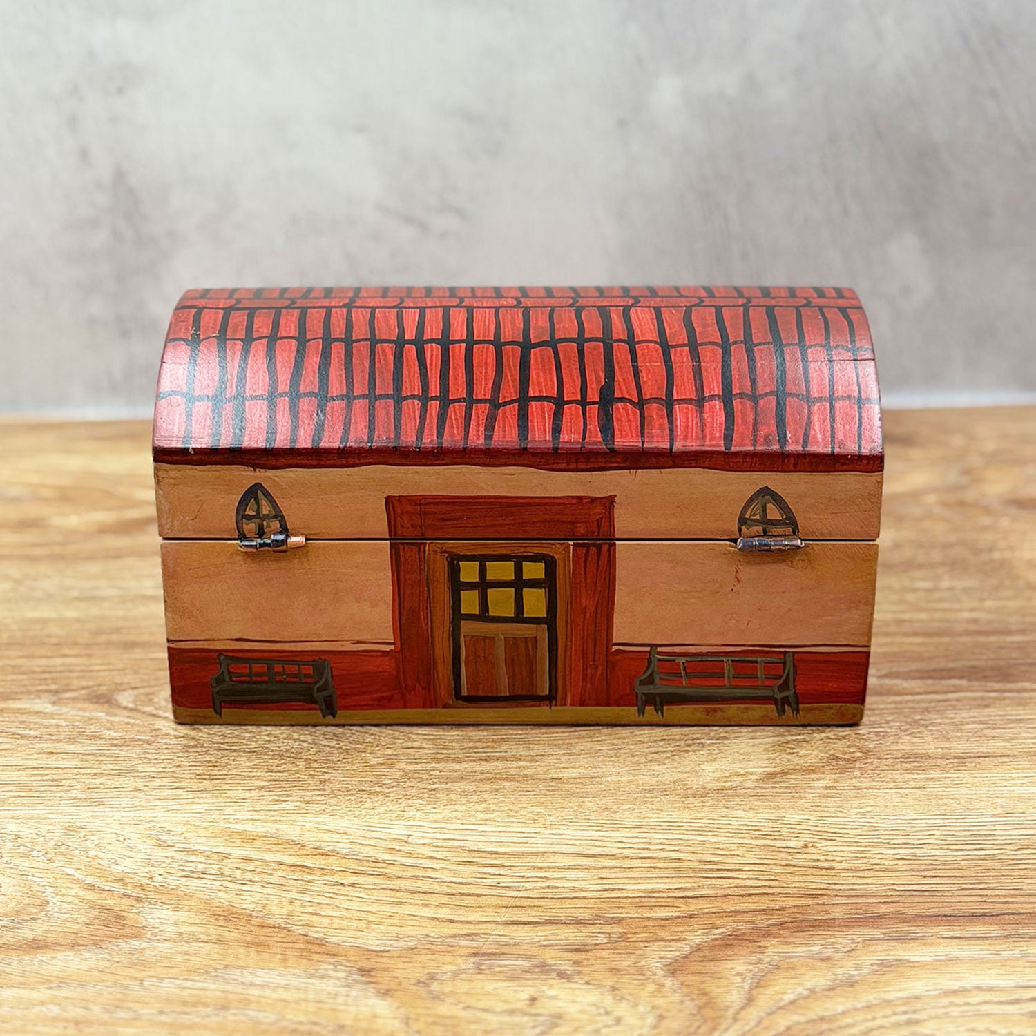 Large chest decorated with a little house design