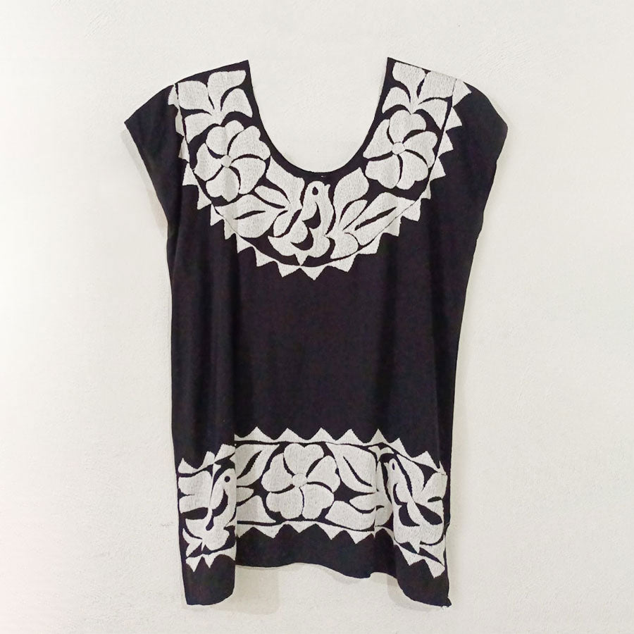 Black blouse with white embroidery