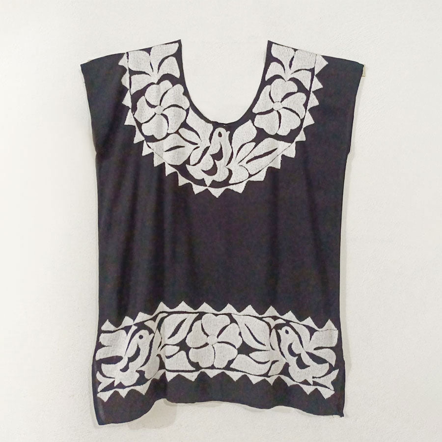 Black blouse with white embroidery