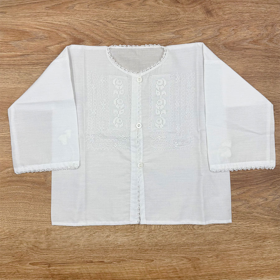 White blouse with cross embroidery in the center for a girl