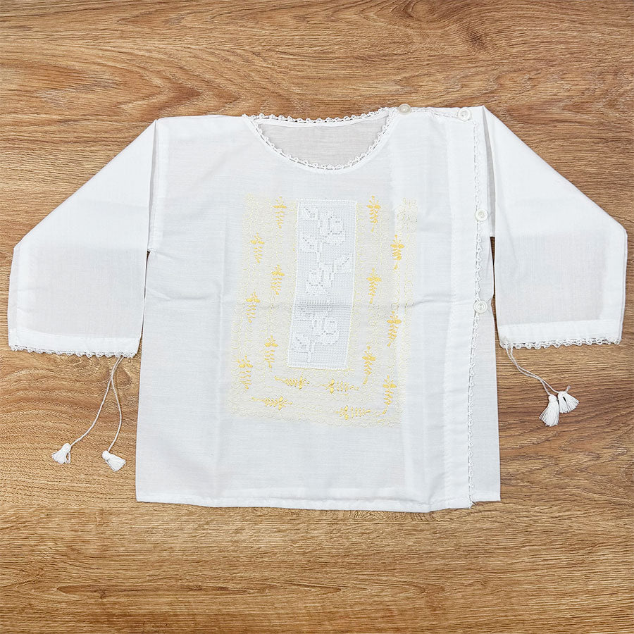 White blouse with cross embroidery in the center for a girl