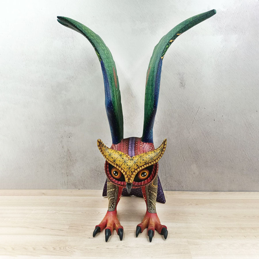 Red and green alebrije owl