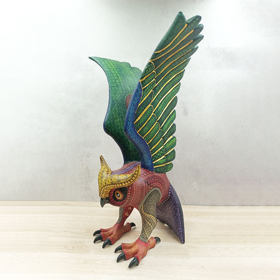 Red and green alebrije owl