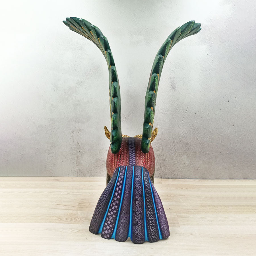 Red and green alebrije owl