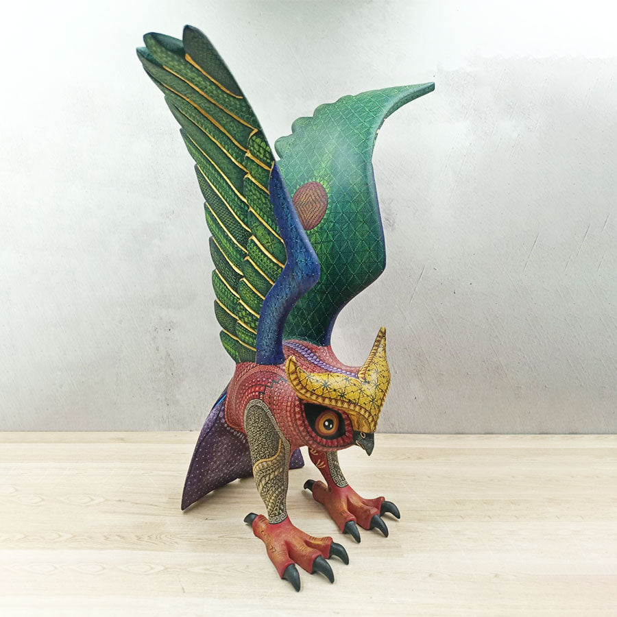 Red and green alebrije owl