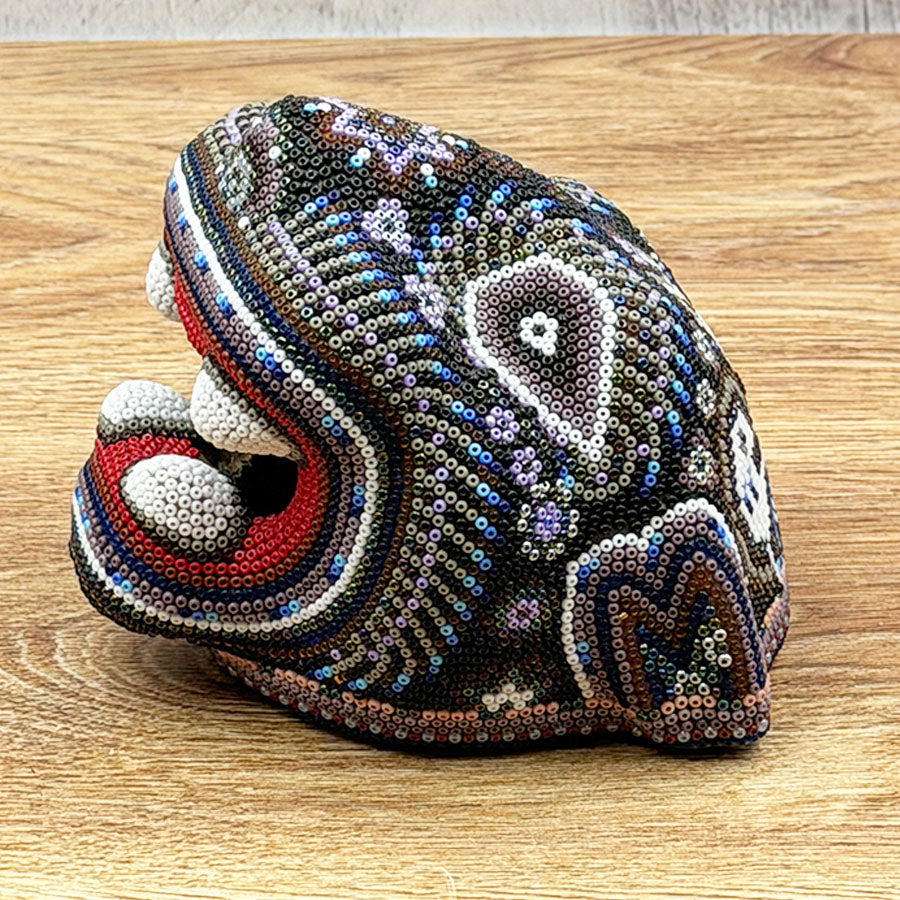 Jaguar head with Huichol art