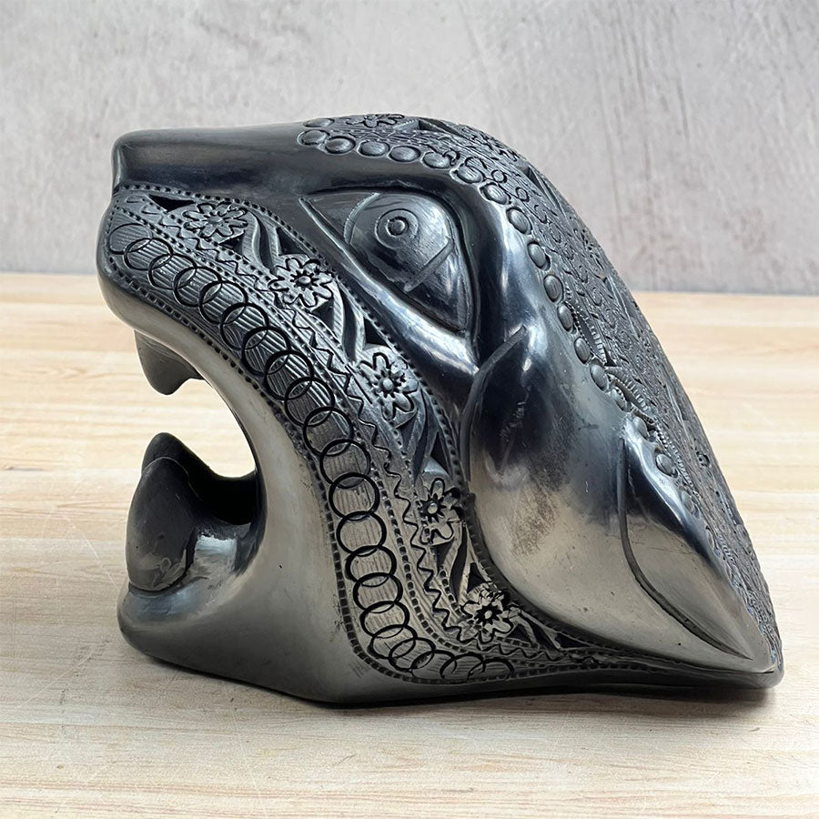 Jaguar head made of black clay