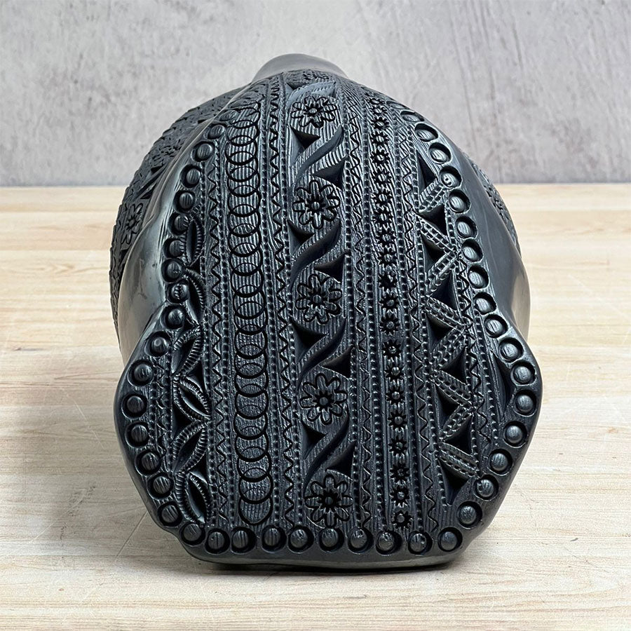 Jaguar head made of black clay