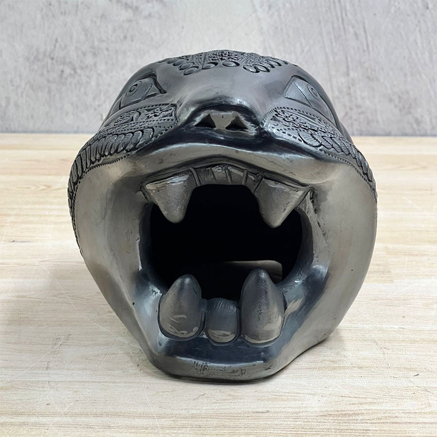 Jaguar head made of black clay