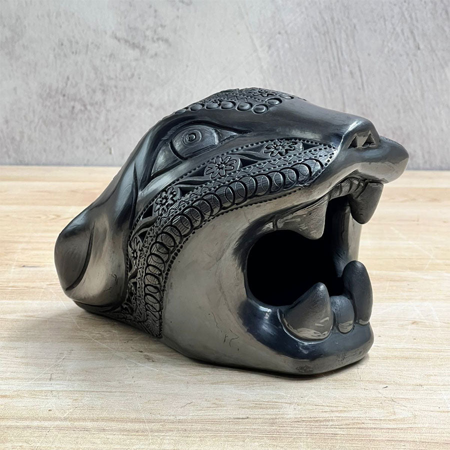 Jaguar head made of black clay