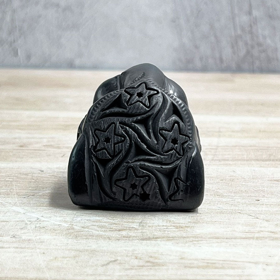 Jaguar head made of black clay