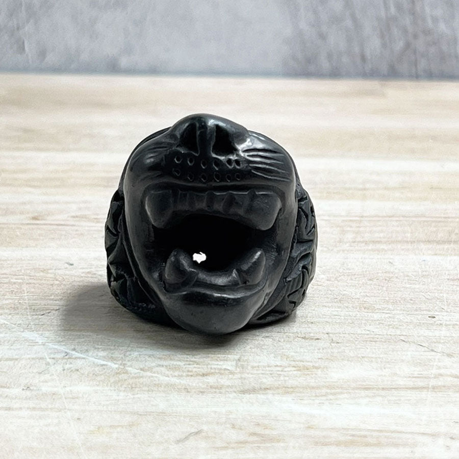 Jaguar head made of black clay