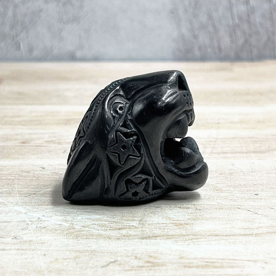 Jaguar head made of black clay