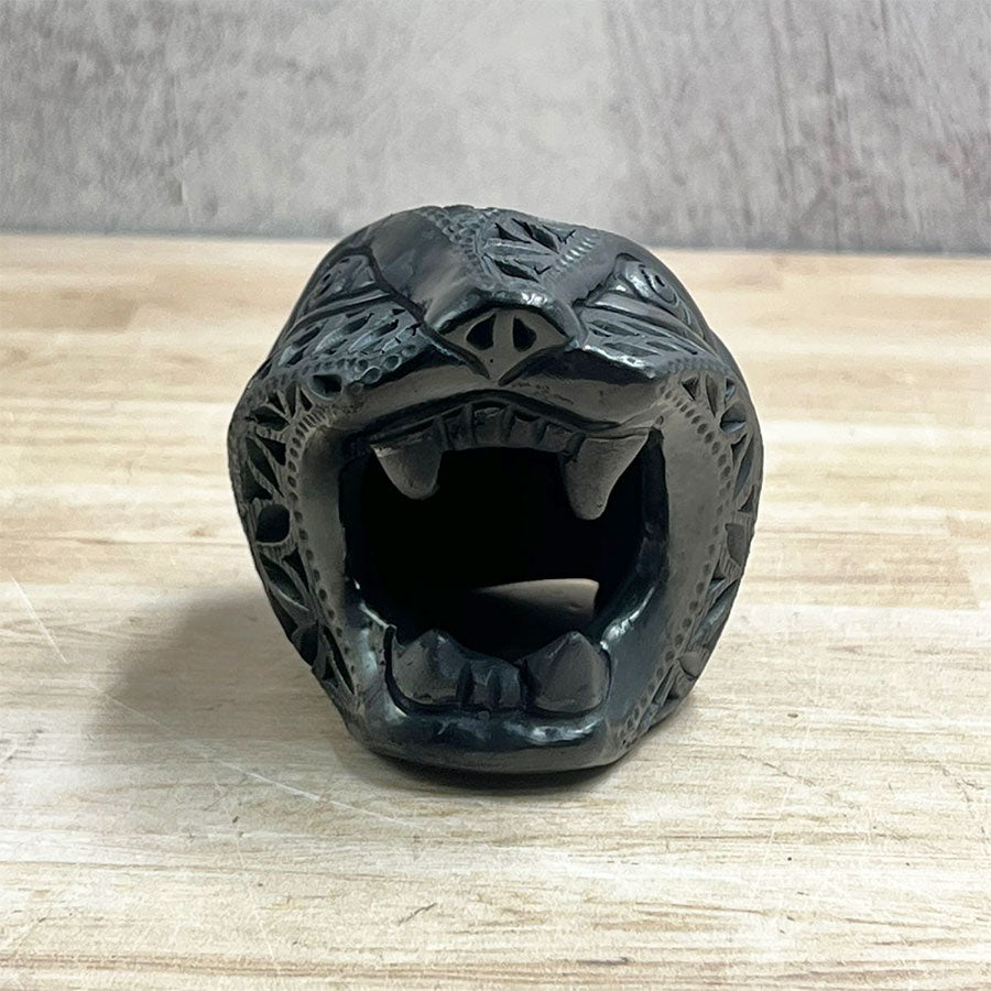 Jaguar head made of black clay