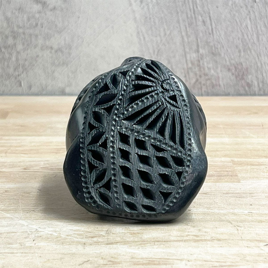 Jaguar head made of black clay