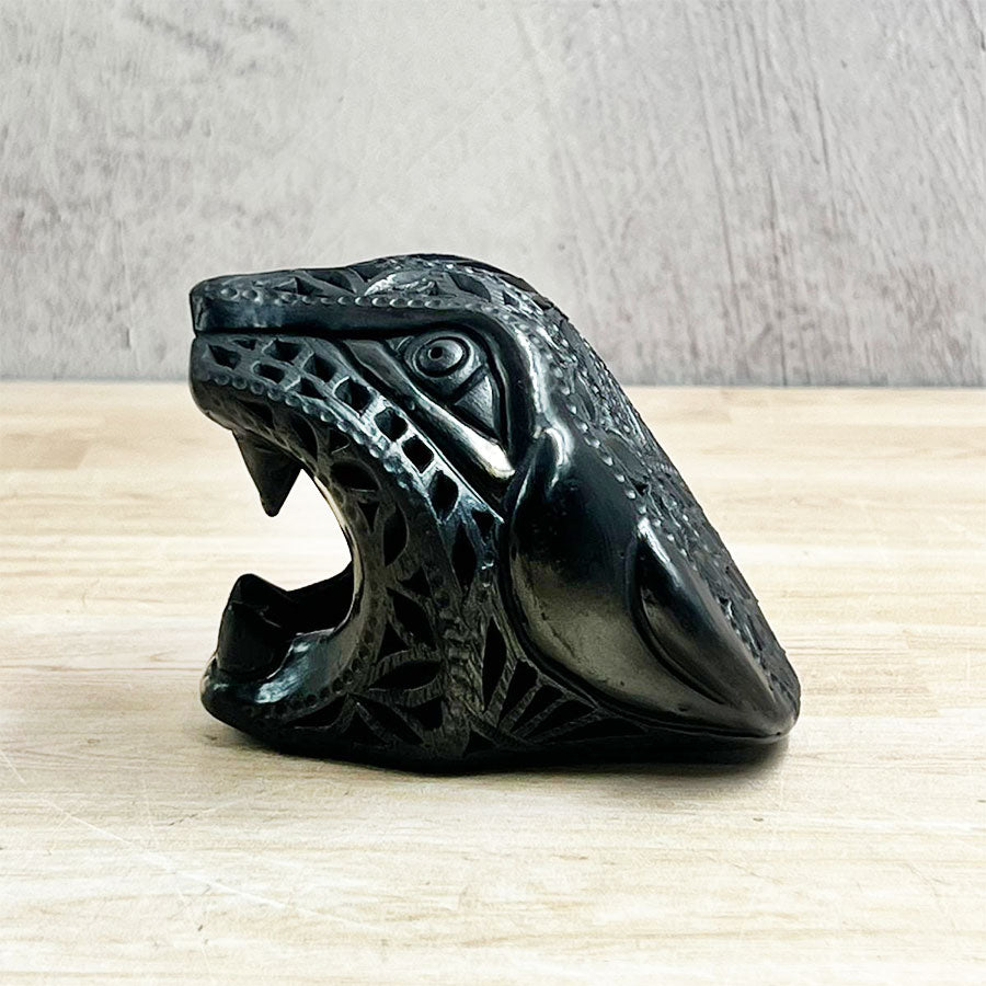 Jaguar head made of black clay