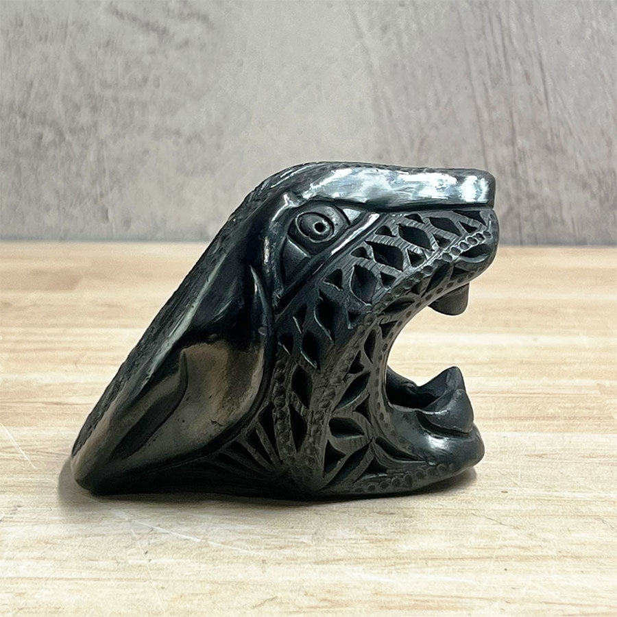 Jaguar head made of black clay