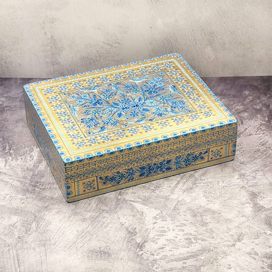 Rectangular gold box with blue design