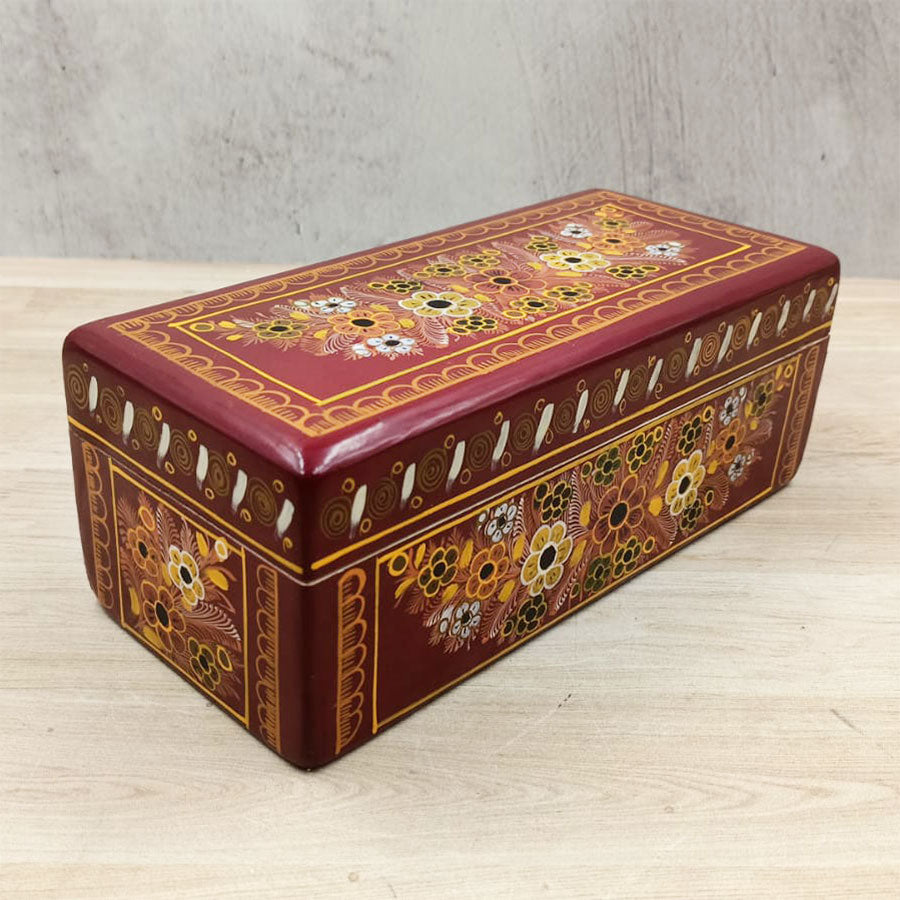 Red wooden box decorated with flowers