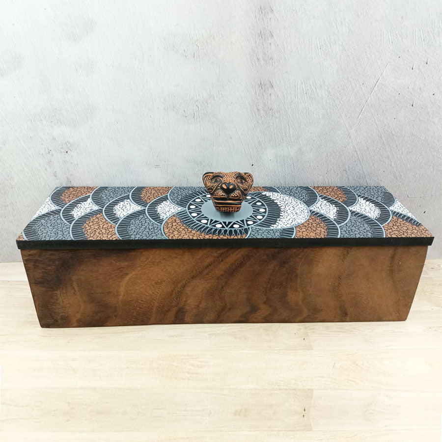 Rectangular box with brown lid with geometric motifs and a jaguar head
