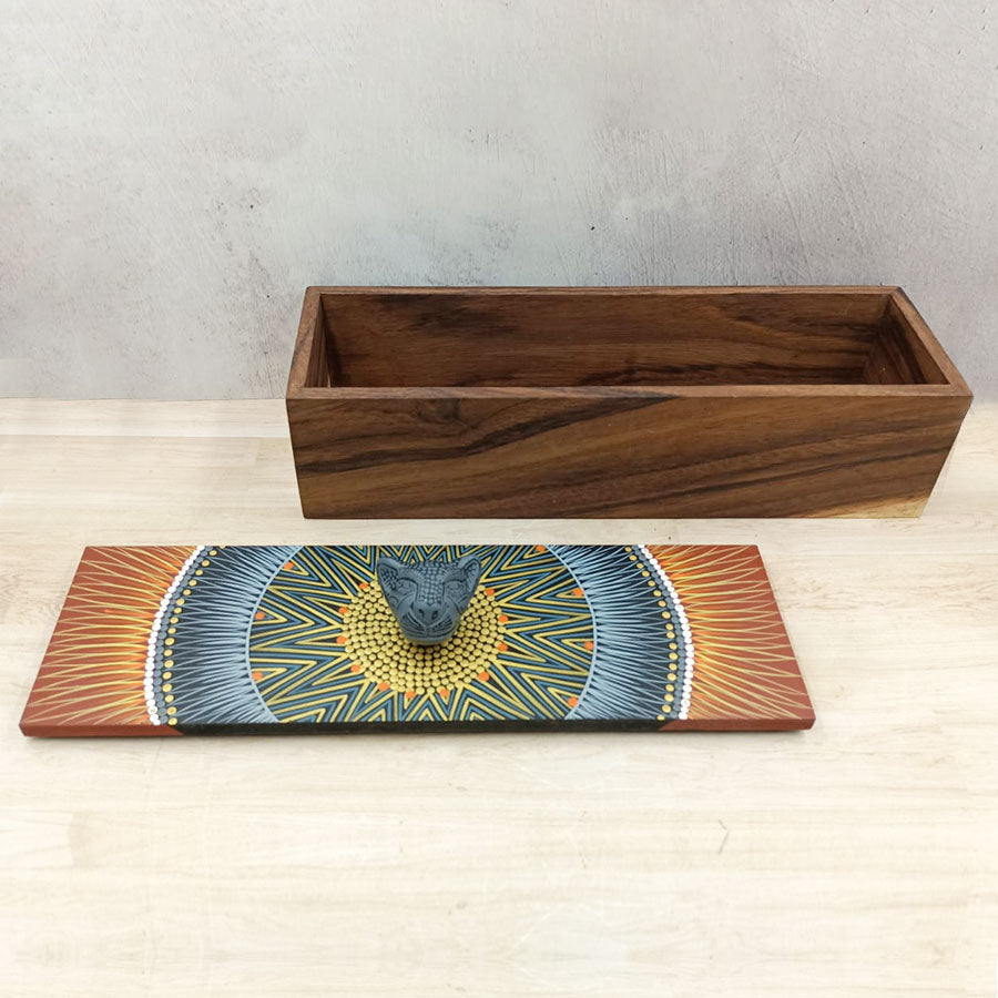 Rectangular box with brown lid with geometric motifs and a jaguar head