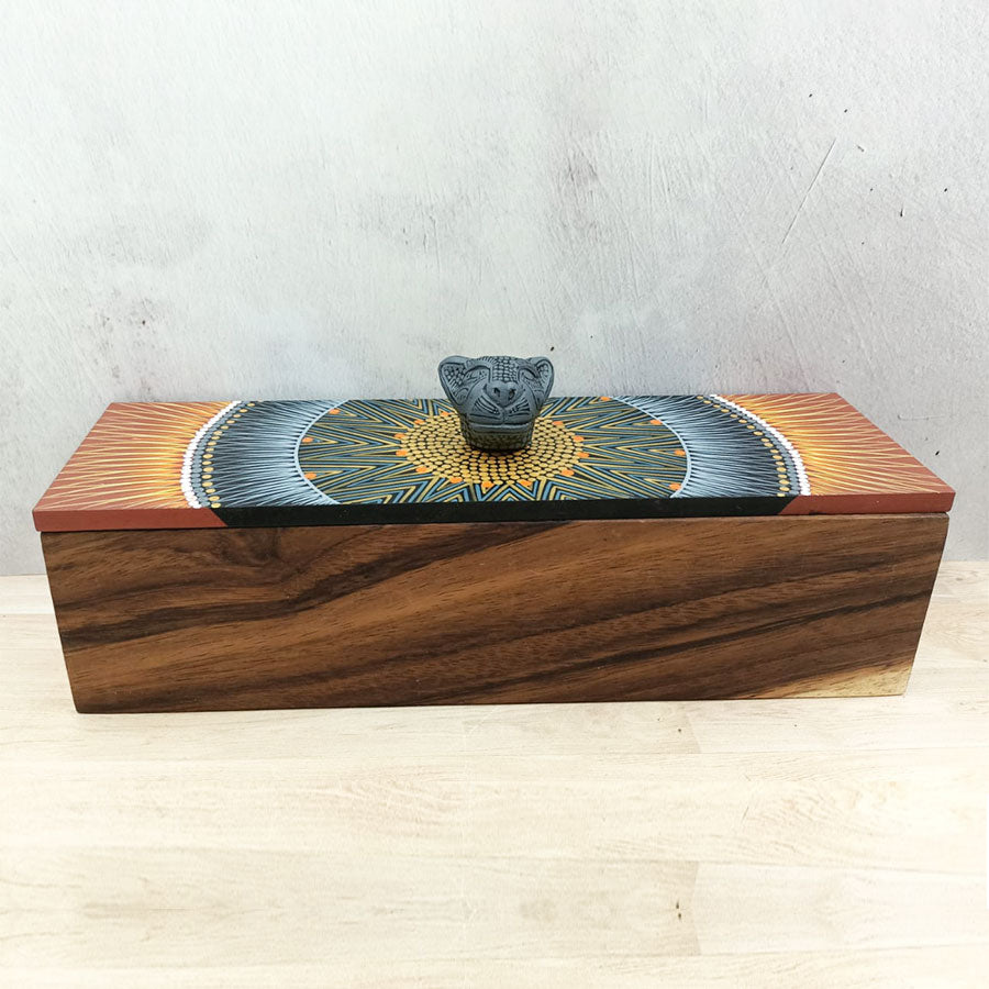 Rectangular box with brown lid with geometric motifs and a jaguar head