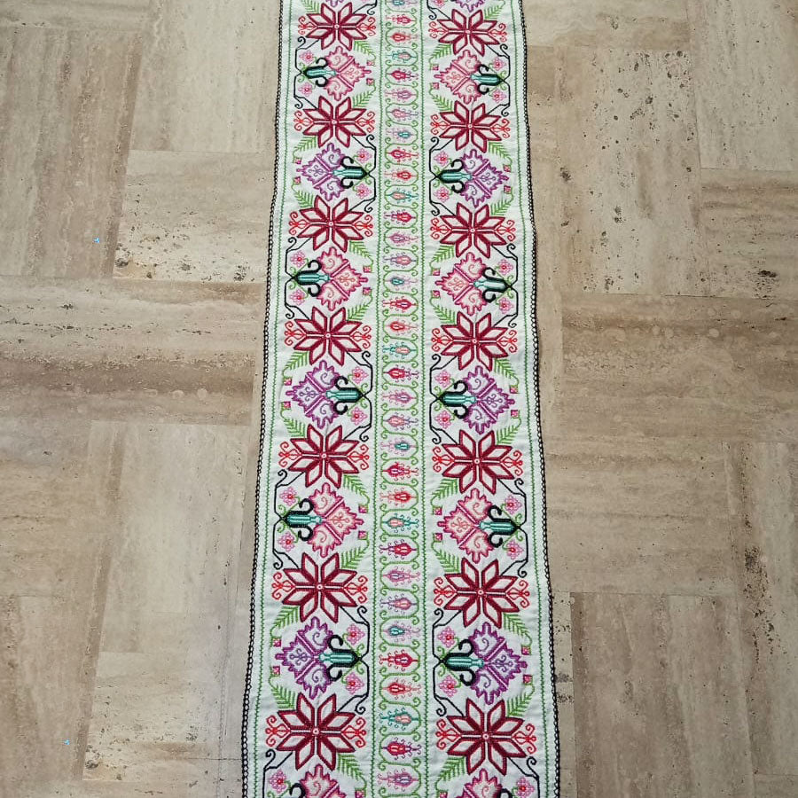 Table runner with embroidered star design