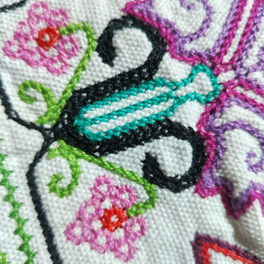 Table runner with embroidered star design