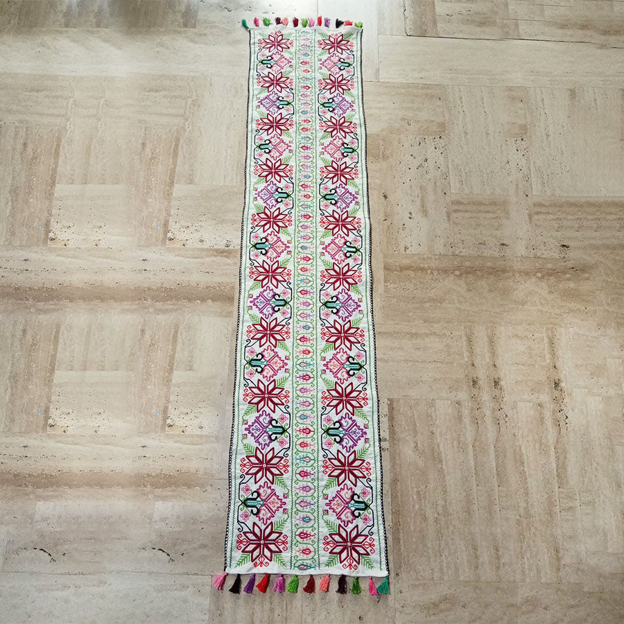 Table runner with embroidered star design